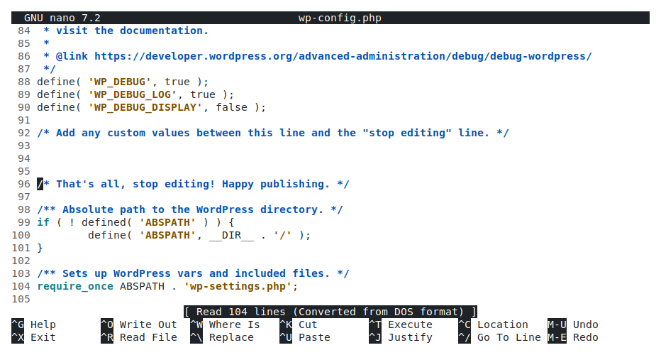 The wp-config.php file open in a code editor showing the WP_DEBUG, WP_DEBUG_LOG and WP_DEBUG_DISPLAY constants added above the “stop editing” line