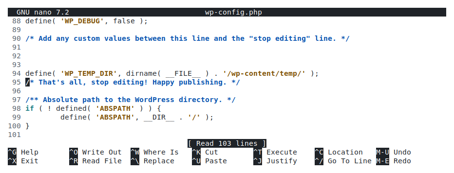 The wp-config.php file open in an editor with the WP_TEMP_DIR define statement added just above the “stop editing” comment line