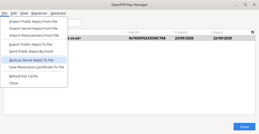 The Thunderbird OpenPGP Key Manager with a personal key selected and the File menu open showing the Backup Secret Key(s) To File option